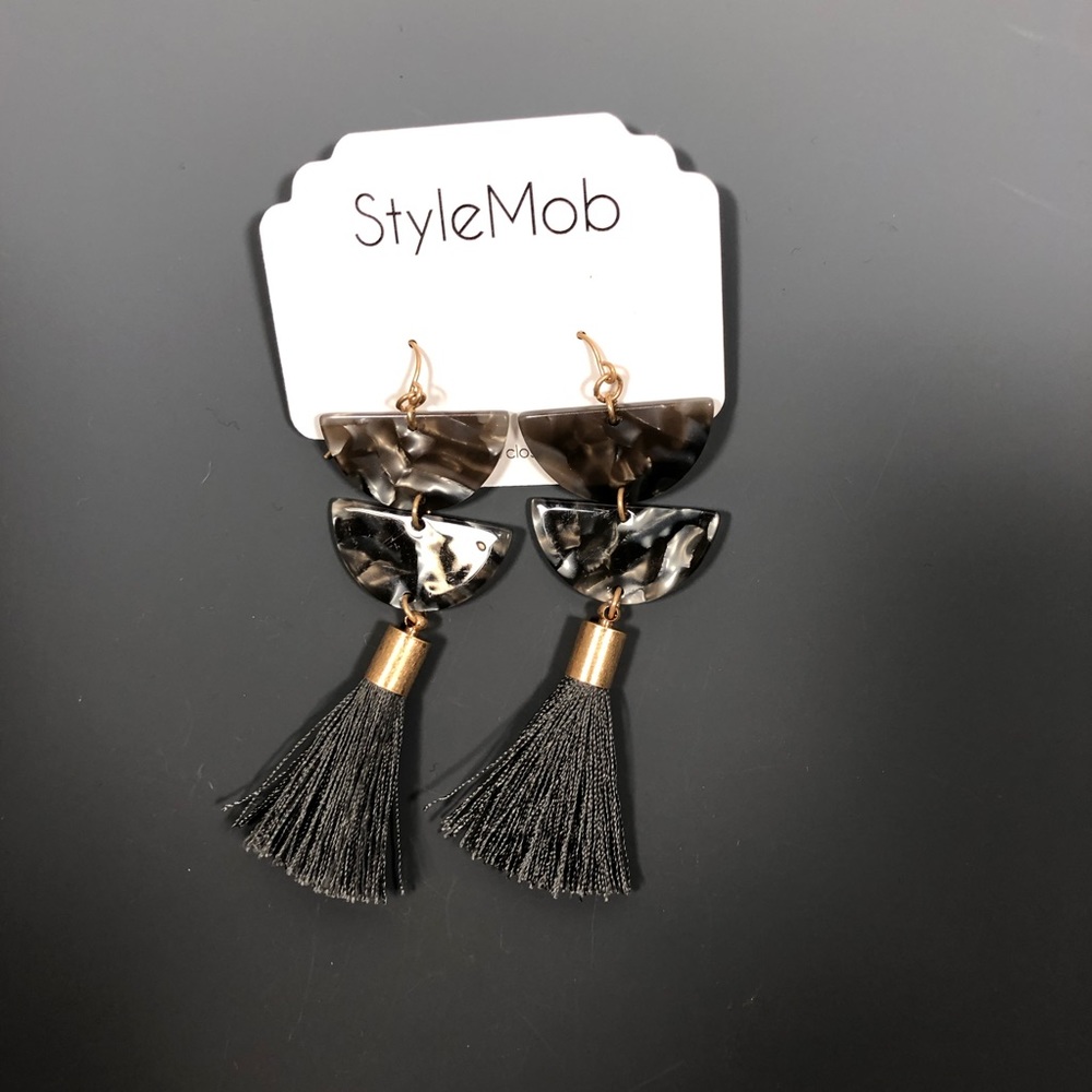Acrylic and tassel earrings.